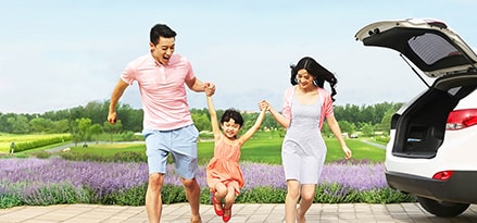 family with white car